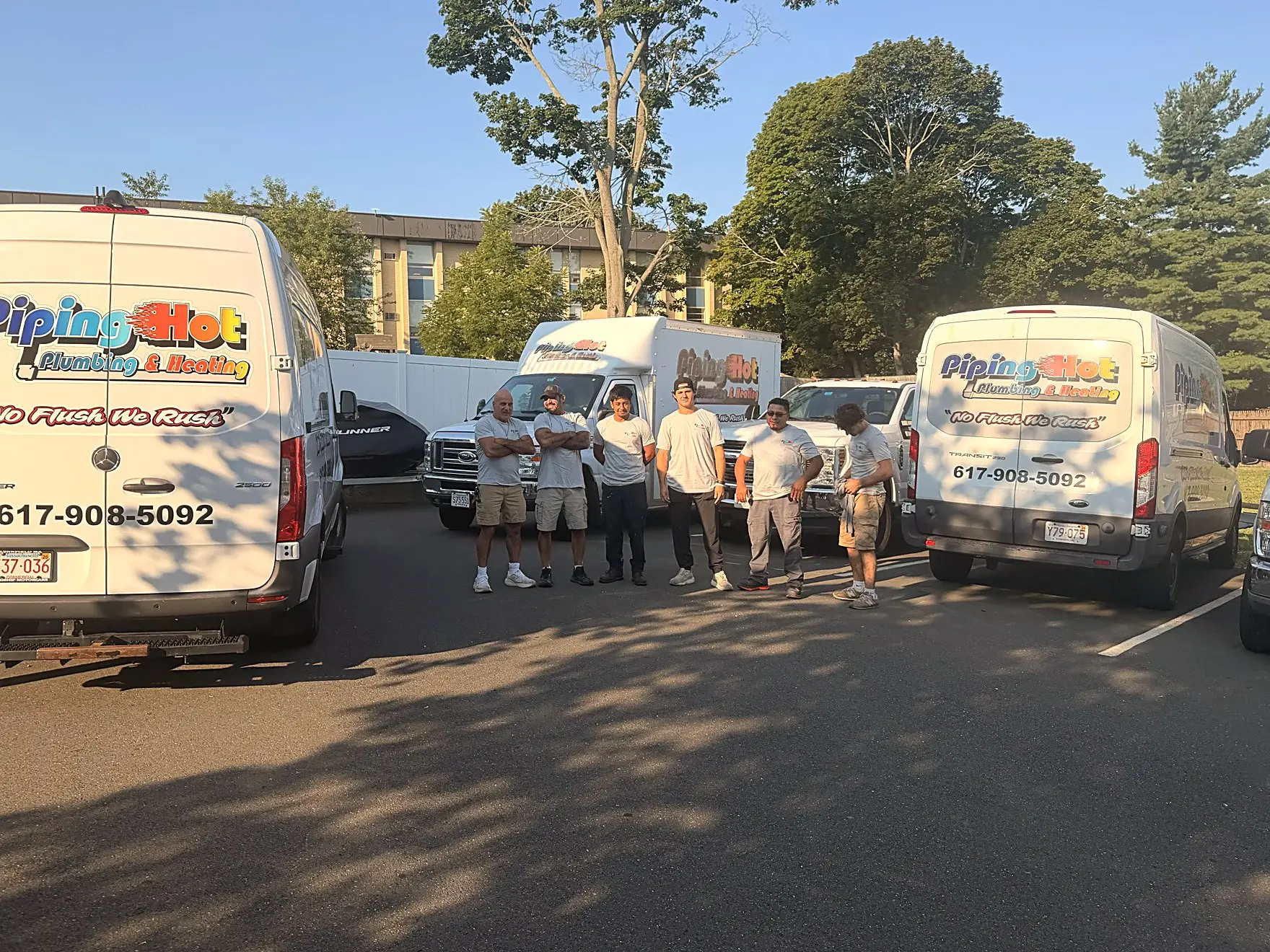 The Piping Hot crew gathered with the company vans